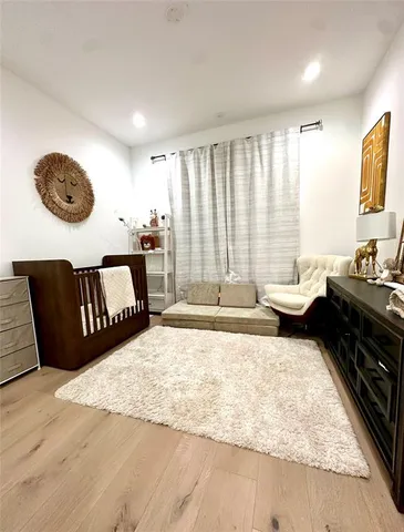 a living room with furniture window and wooden floor