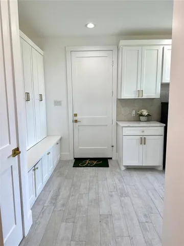 a bathroom with a sink a mirror and a bathtub