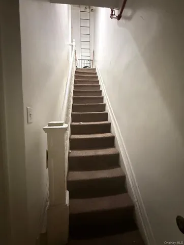 a room with a bed and a chair