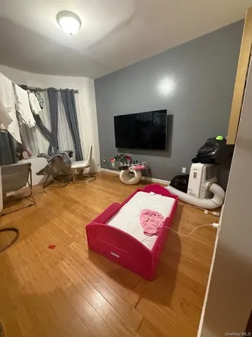 a kitchen with granite countertop a stove a sink a microwave and wooden cabinets