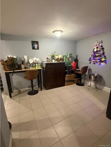 a kitchen with stainless steel appliances granite countertop a refrigerator a sink a stove and a refrigerator