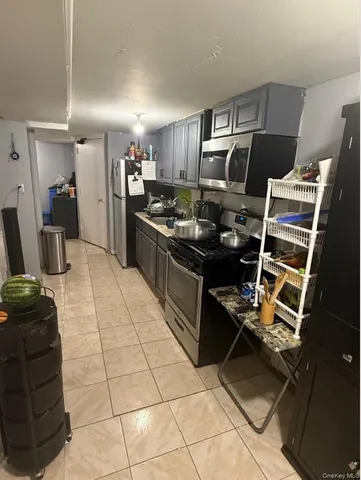 a hallway with a table and a workspace