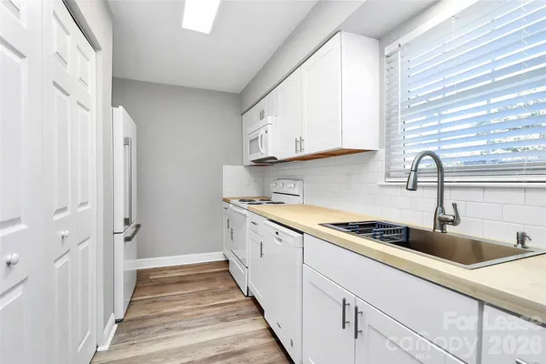 a kitchen with a sink and cabinets