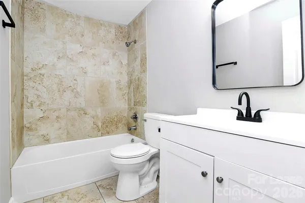 a bathroom with a sink a toilet and a bathtub
