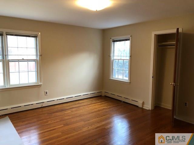 17 Clausen Road Edison, NJ 08817 - Photo 12 of 18 an empty room with wooden floor and windows
