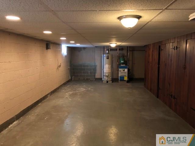 17 Clausen Road Edison, NJ 08817 - Photo 14 of 18 an empty room with a projector and a projector
