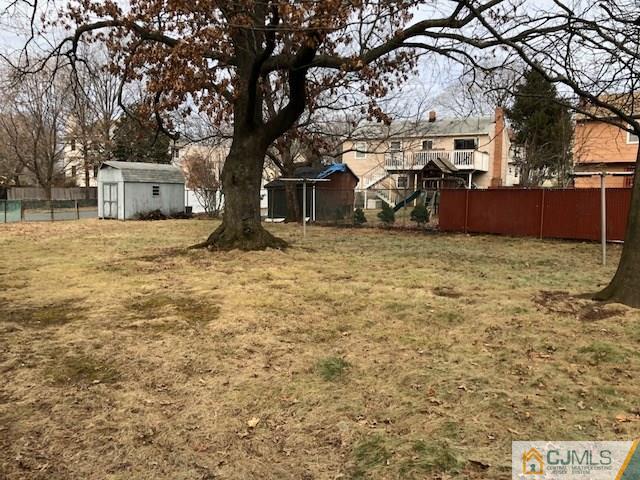 17 Clausen Road Edison, NJ 08817 - Photo 15 of 18 a tree in front of a white house