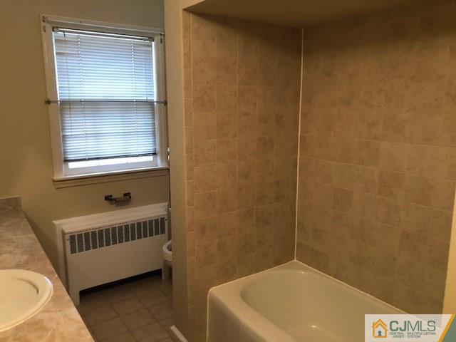 17 Clausen Road Edison, NJ 08817 - Photo 18 of 18 a bathroom with a bathtub and a window