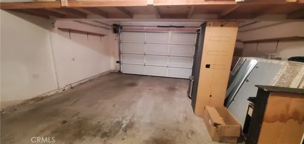 a view of a closet with wooden wall