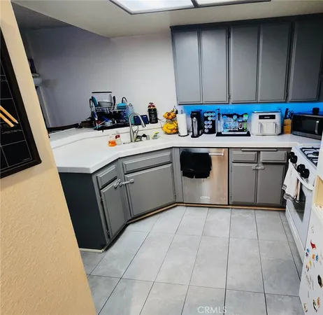 a utility room with sink dryer and washer