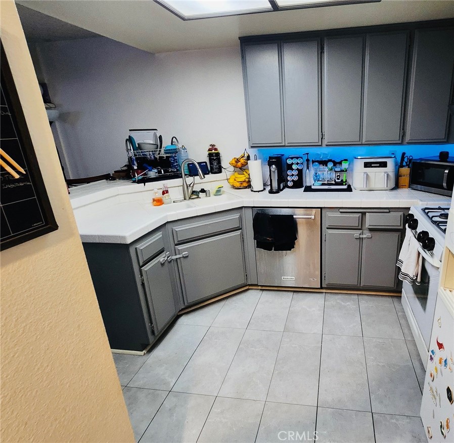 6443 Stoney View Lane, Unit 4 Simi Valley, CA 93063 - Photo 4 of 13 a utility room with sink dryer and washer
