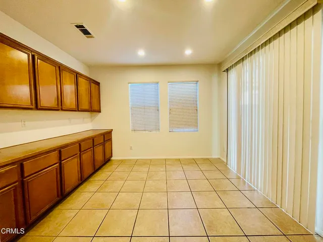 a view of a kitchen with windows
