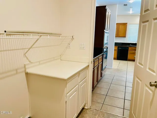 a utility room with cabinets