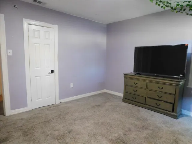 a room with furniture and flat screen tv