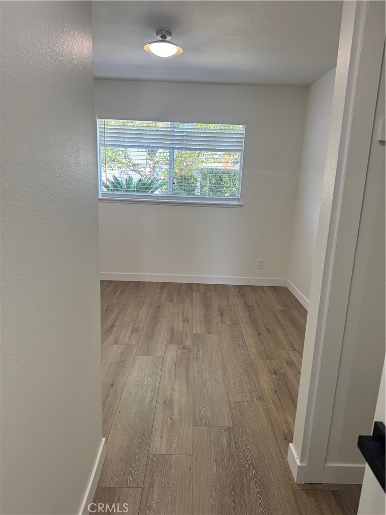 20157 Mckay Drive Walnut, CA 91789 - Photo 12 of 15 an empty room with wooden floor and windows