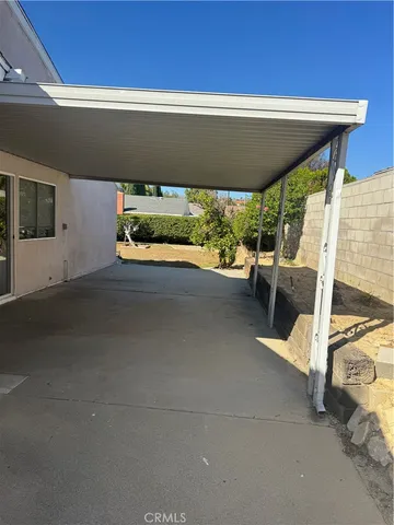 a view of a backyard with swimming pool
