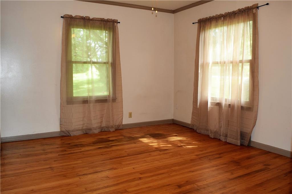 447 Achortown Road Beaver Falls, PA 15010 - Photo 3 of 25 Living Room has 2 windows and original hardwood floors