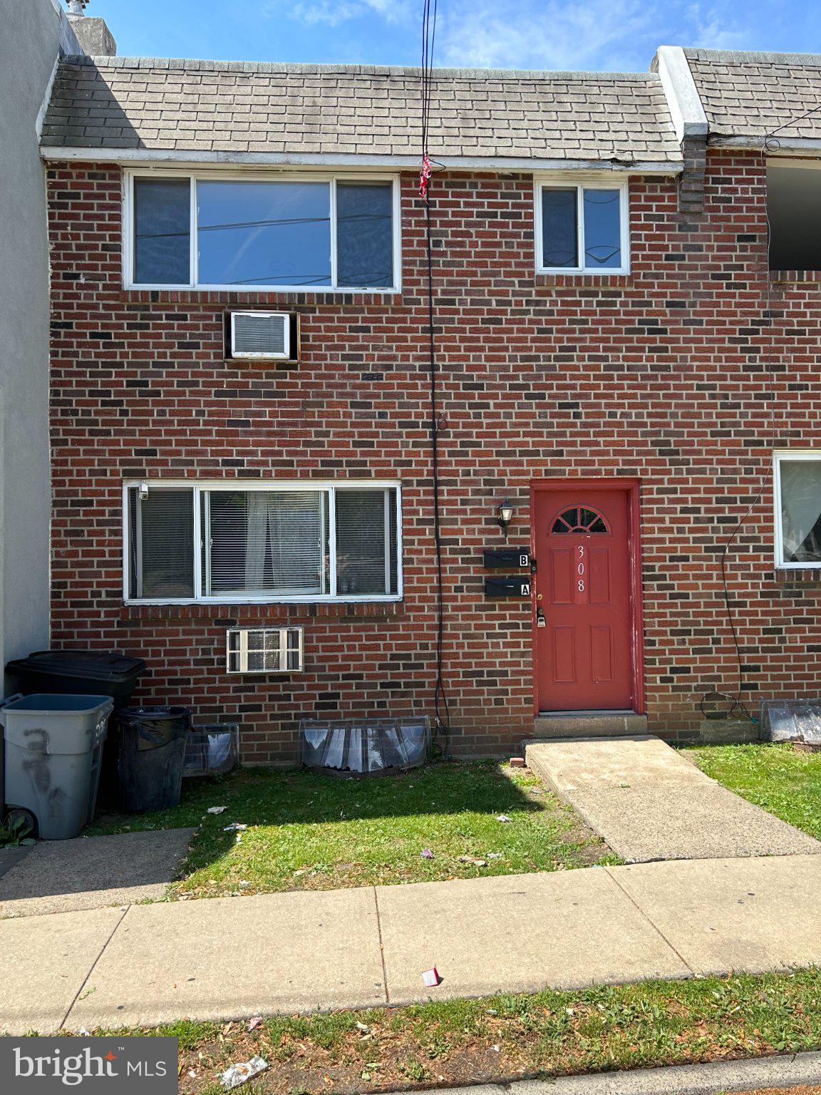 308 Burmont Road Drexel Hill, PA 19026 - Photo 1 of 20 Charming brick facade with vibrant door.