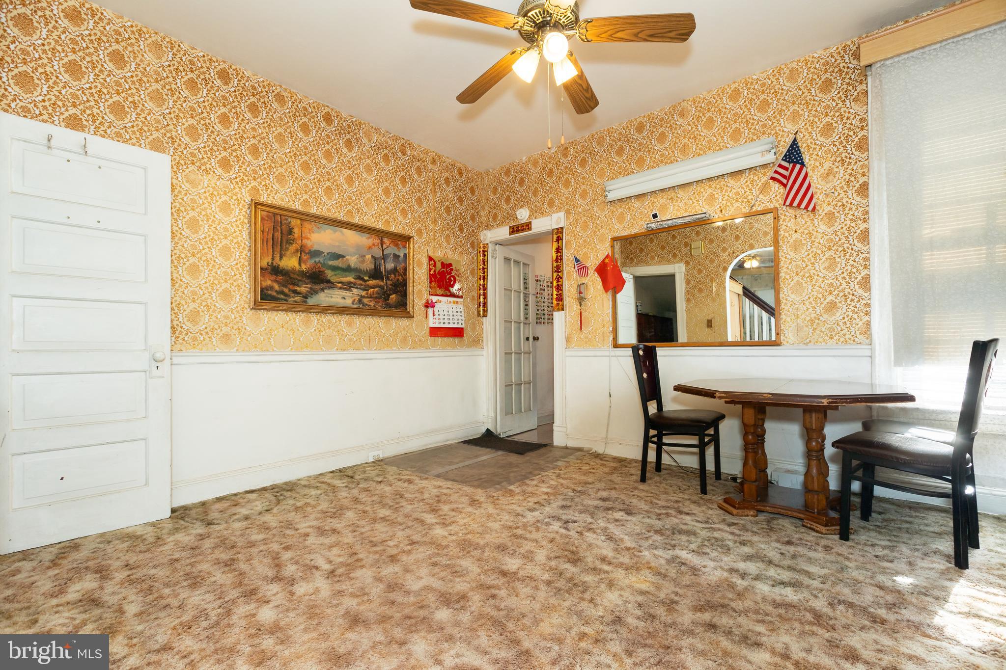 505 East 35th Street Baltimore, MD 21218 - Photo 17 of 45 a view of a workspace with furniture and a window