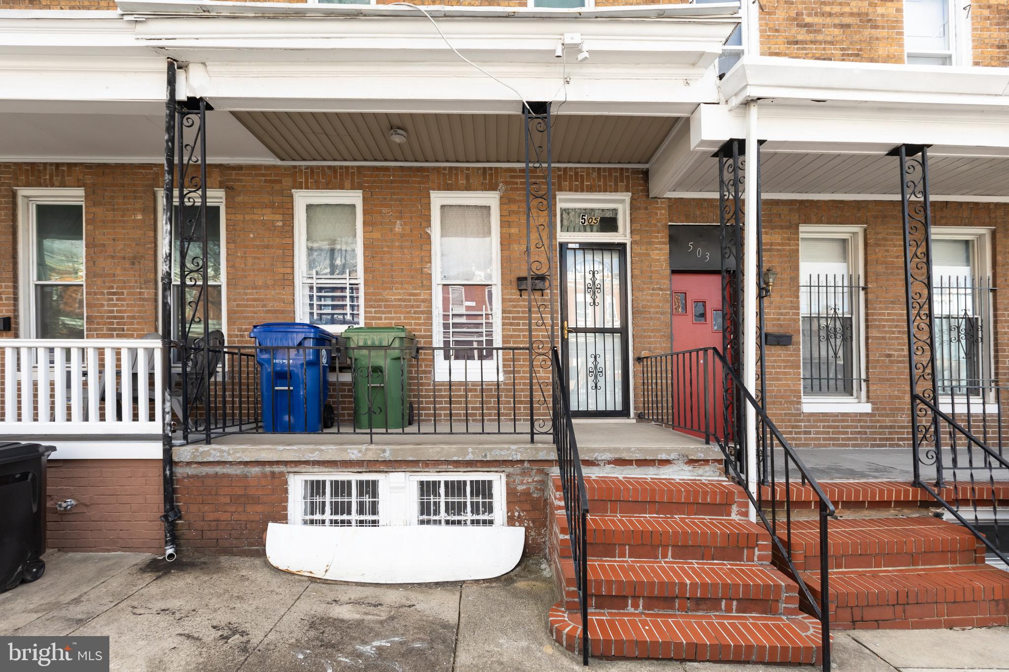 505 East 35th Street Baltimore, MD 21218 - Photo 2 of 45 a front view of a house with a table and chairs