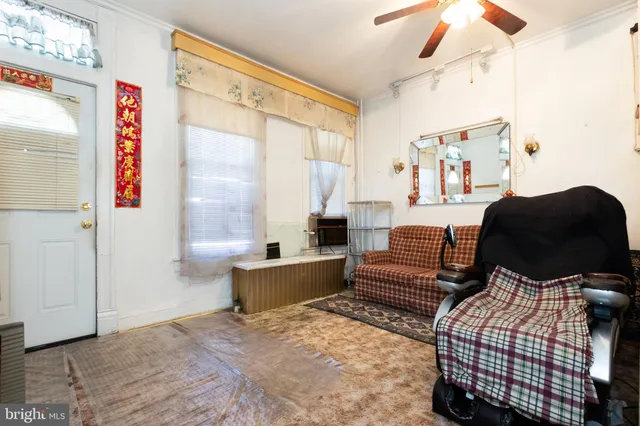 a bathroom with a sink a toilet and a shower curtain