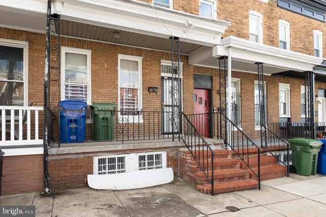 a front view of a house with parking space