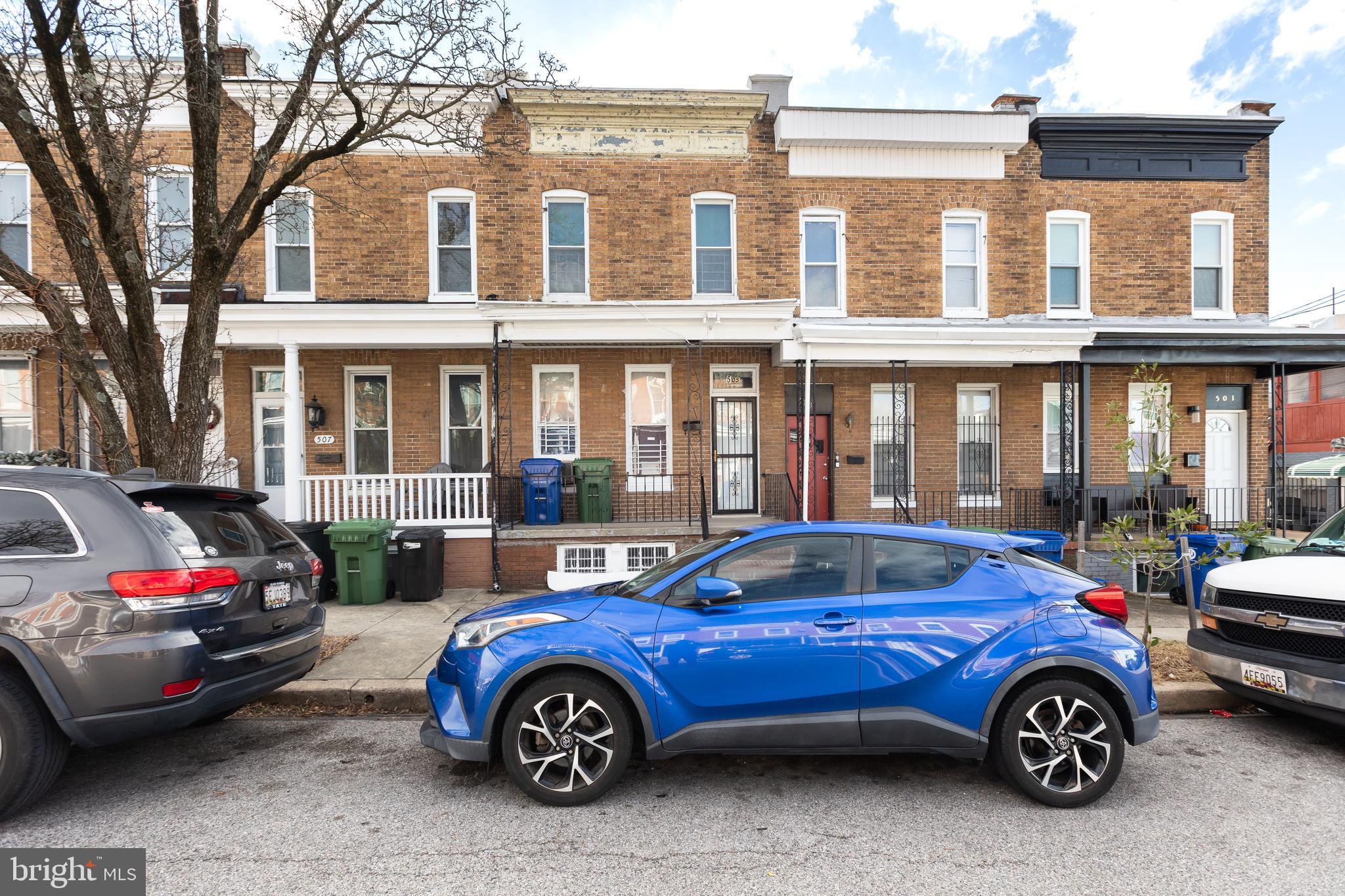 505 East 35th Street Baltimore, MD 21218 - Photo 6 of 45 a front view of a house with parking space