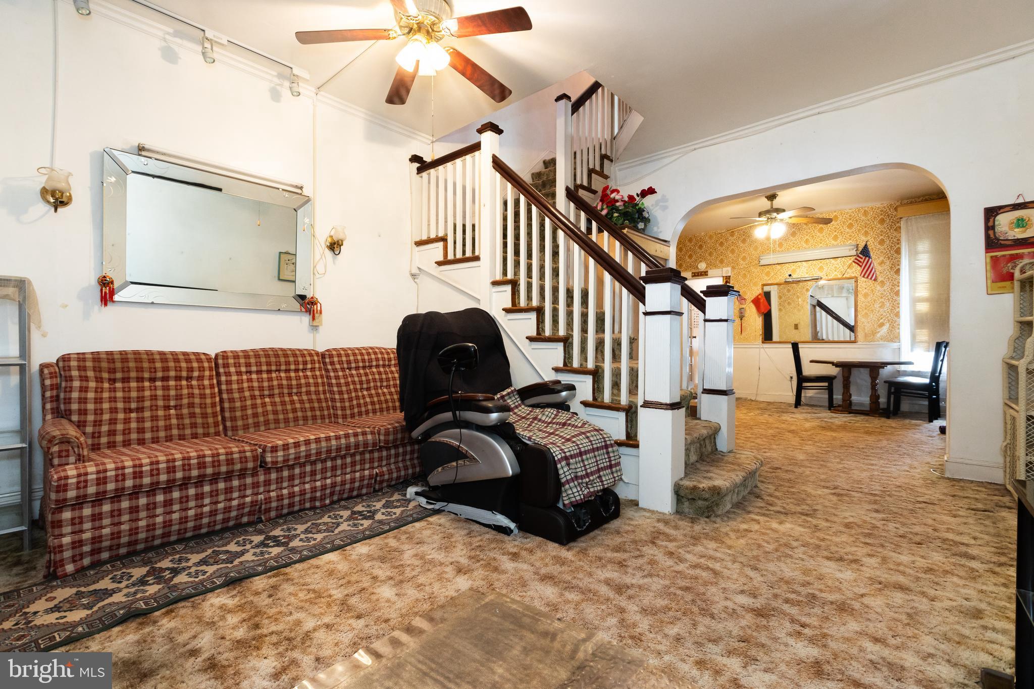 505 East 35th Street Baltimore, MD 21218 - Photo 9 of 45 a view of a livingroom with furniture and staircase