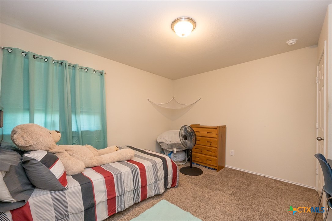 2511 Pintail Loop Copperas Cove, TX 76522 - Photo 20 of 26 a bedroom with a bed and a window