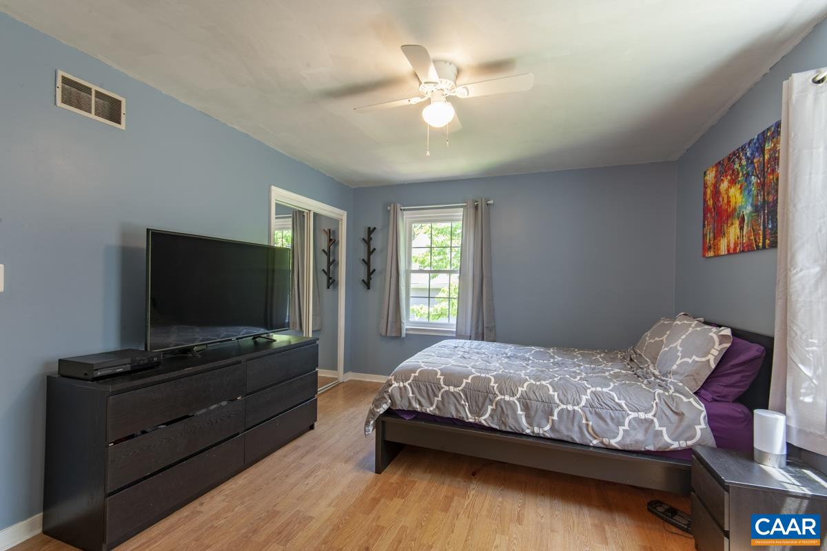 368 Minor Ridge Road Charlottesville, VA 22901 - Photo 13 of 29 a bedroom with a bed and a flat screen tv