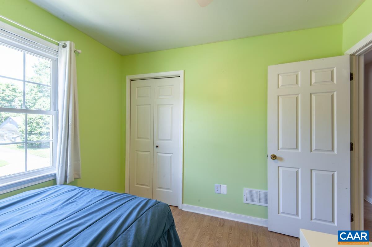 368 Minor Ridge Road Charlottesville, VA 22901 - Photo 16 of 29 a bedroom with a bed and a window