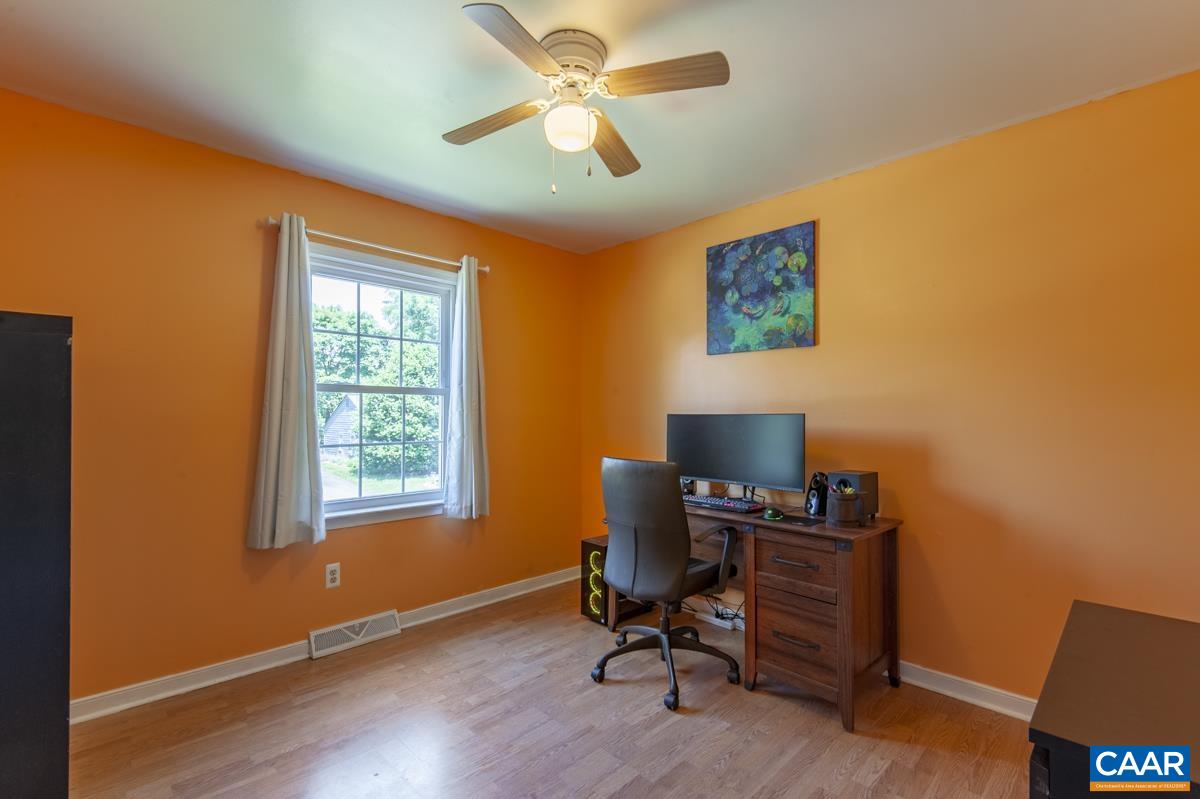 368 Minor Ridge Road Charlottesville, VA 22901 - Photo 17 of 29 a view of a workspace with furniture and a window