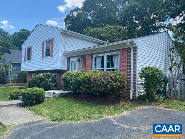 368 Minor Ridge Road Charlottesville, VA 22901 - Photo 2 of 29 a view of a house with a yard plants and large tree