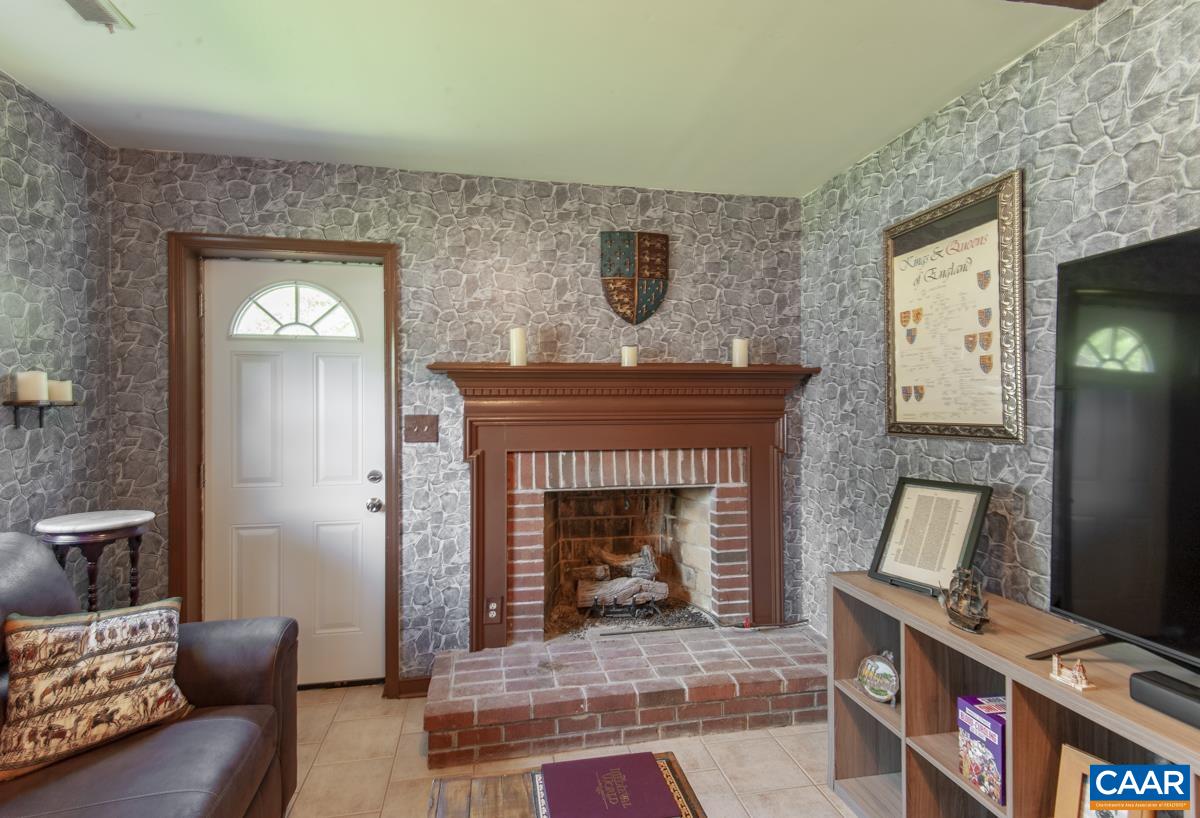 368 Minor Ridge Road Charlottesville, VA 22901 - Photo 22 of 29 a living room with furniture and a fireplace
