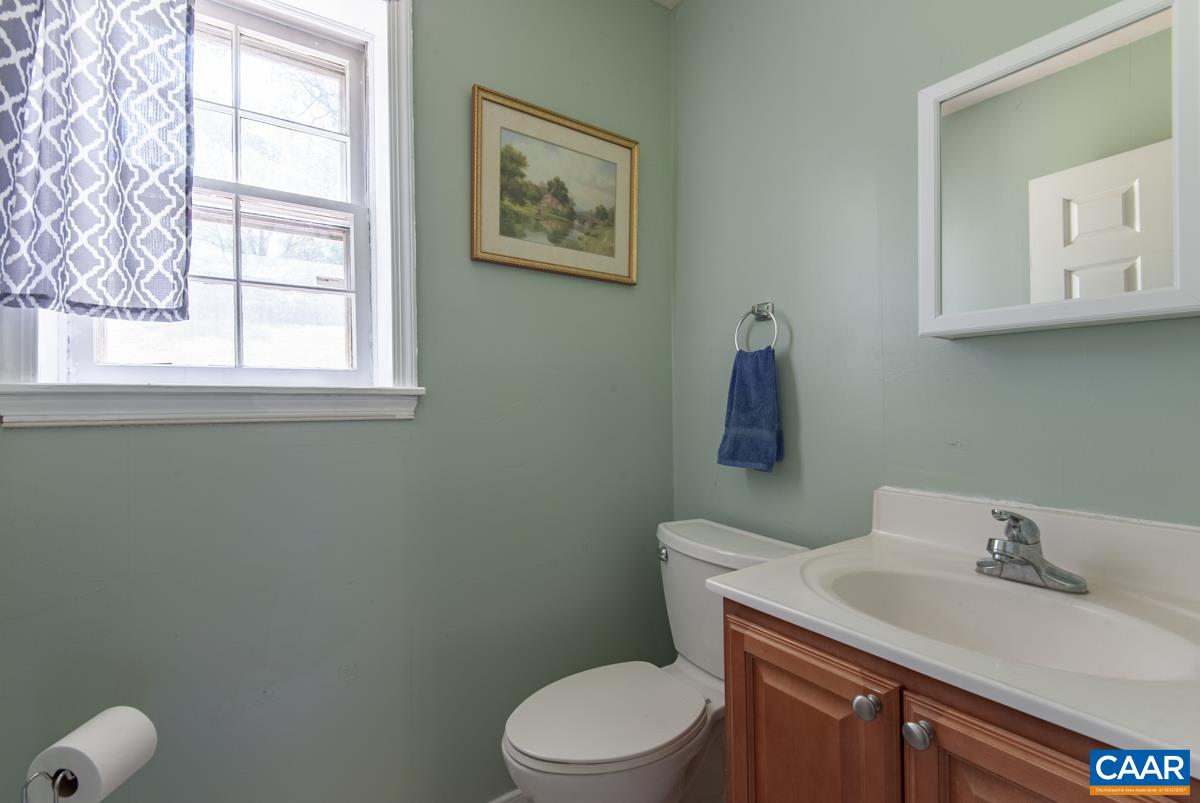 368 Minor Ridge Road Charlottesville, VA 22901 - Photo 23 of 29 a bathroom with a toilet sink vanity and mirror