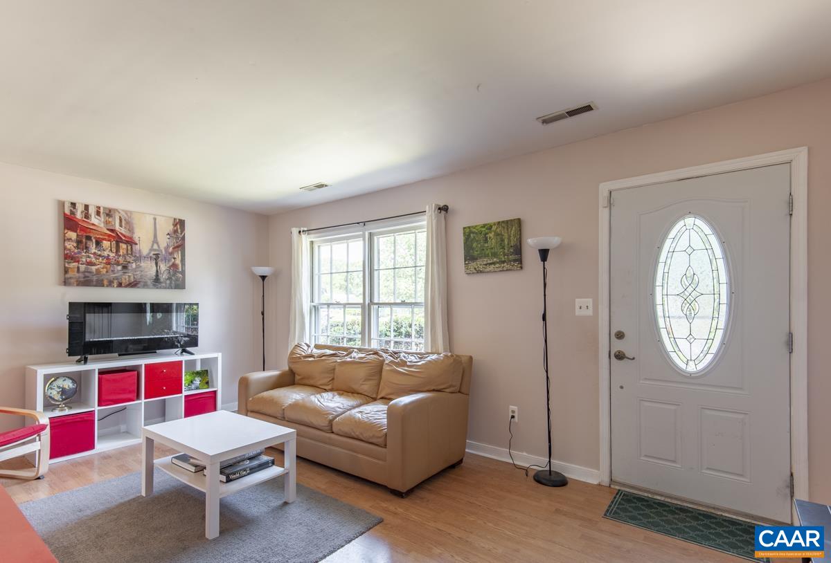 368 Minor Ridge Road Charlottesville, VA 22901 - Photo 4 of 29 a living room with furniture and a flat screen tv