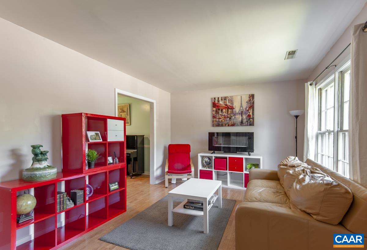 368 Minor Ridge Road Charlottesville, VA 22901 - Photo 5 of 29 a living room with furniture toys and a flat screen tv