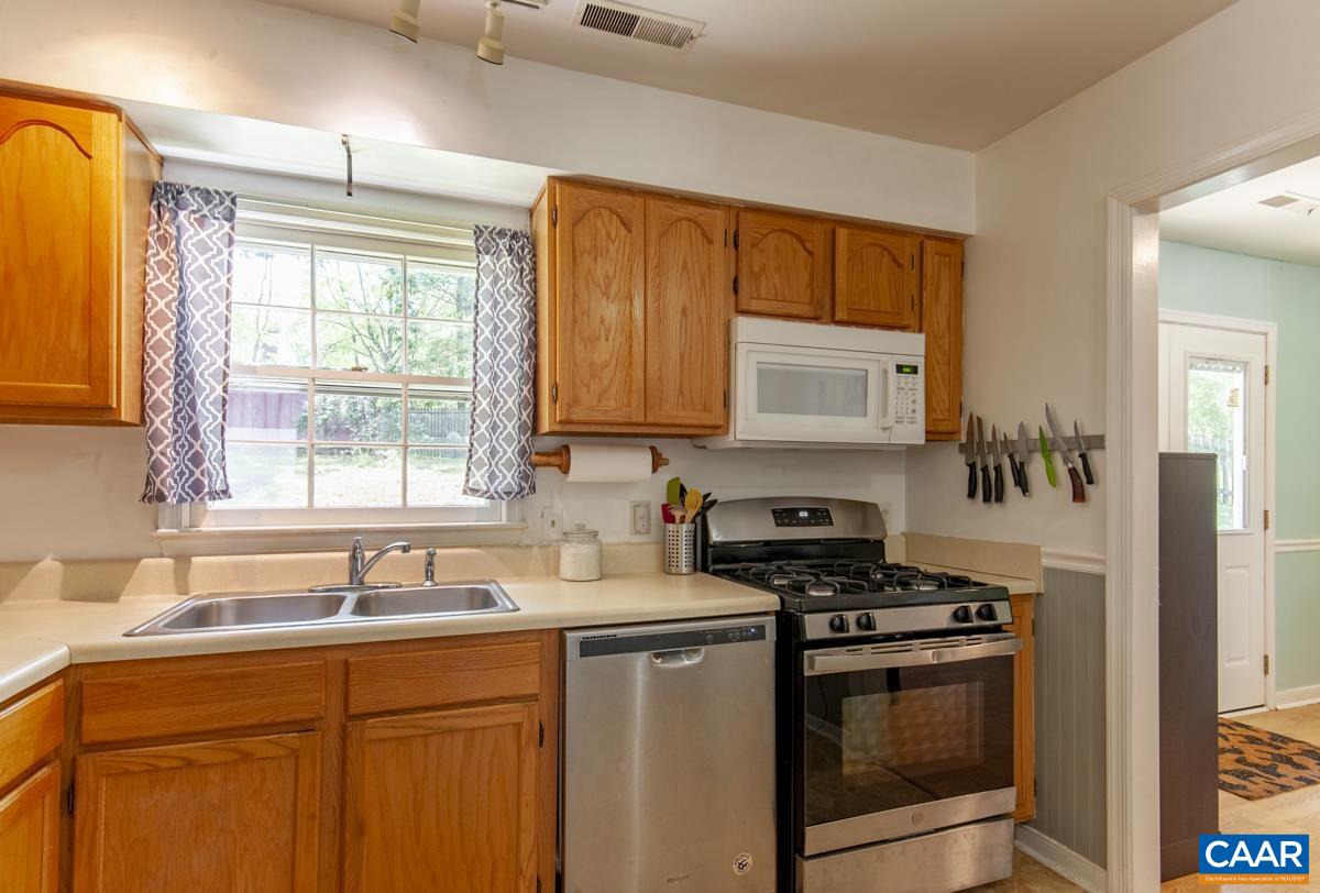 368 Minor Ridge Road Charlottesville, VA 22901 - Photo 10 of 29 a kitchen with stainless steel appliances a stove a sink and a microwave