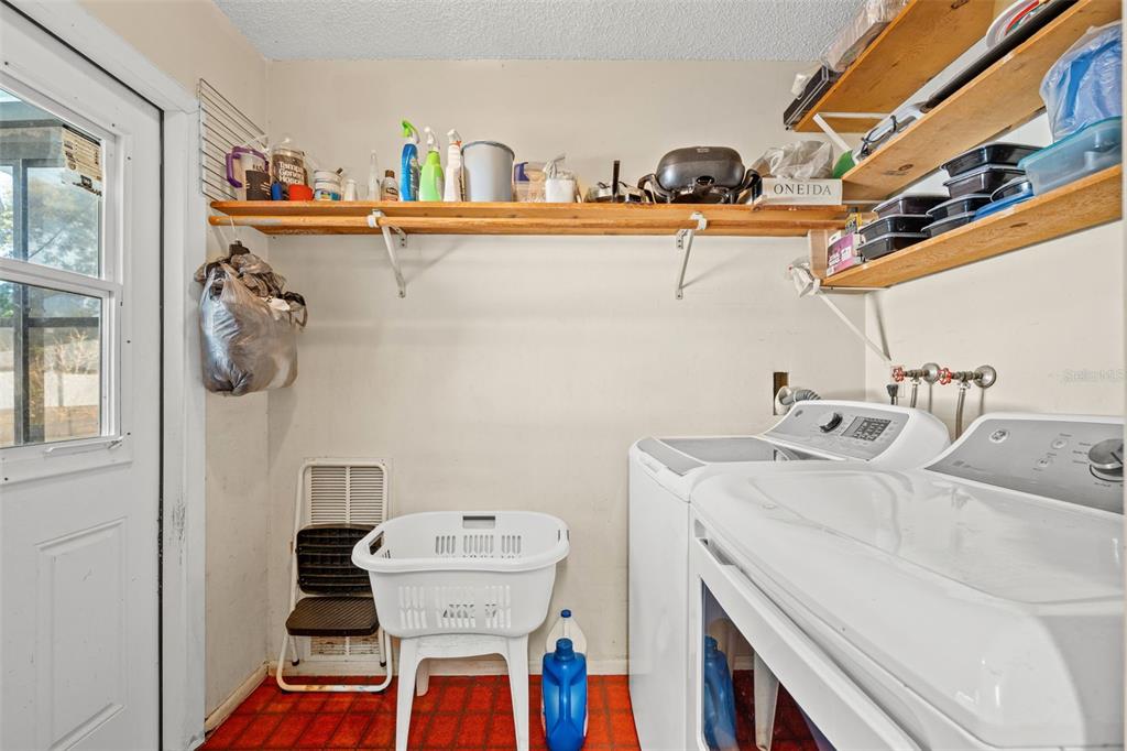 9061 Byron Street Spring Hill, FL 34606 - Photo 18 of 43 a utility room with dryer and washer