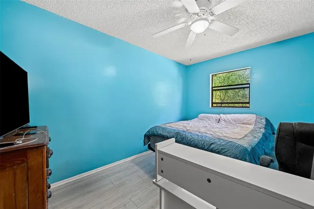 a bedroom with bed and a window