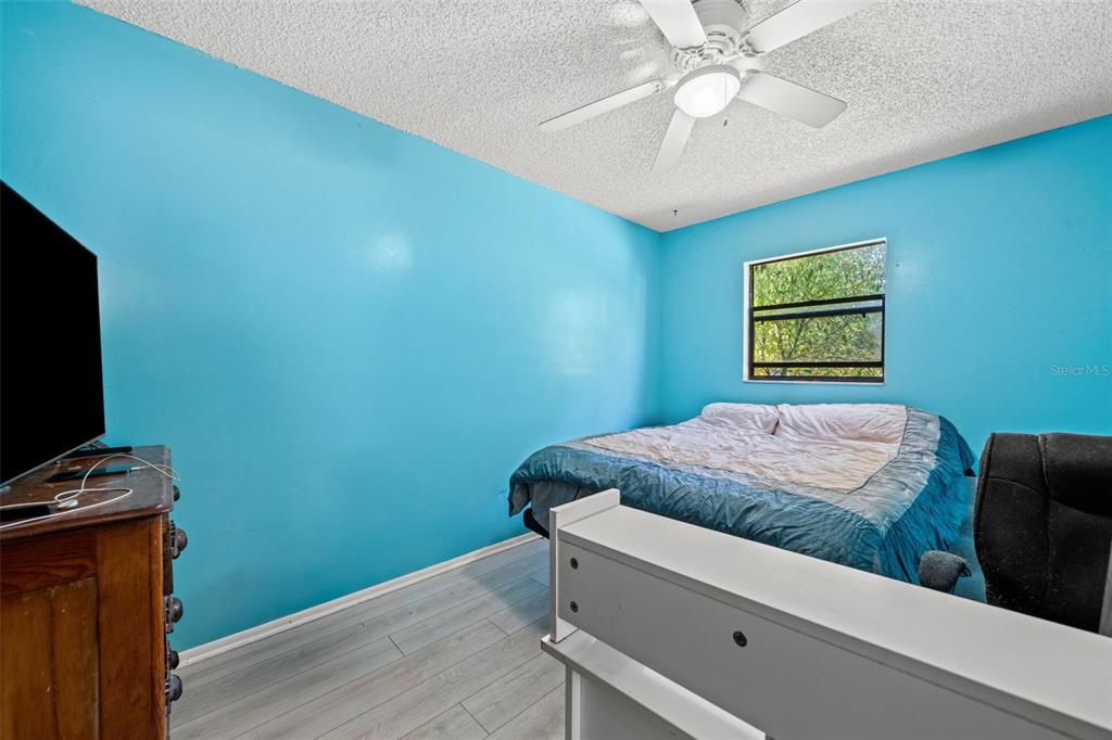 9061 Byron Street Spring Hill, FL 34606 - Photo 25 of 43 a bedroom with bed and a window