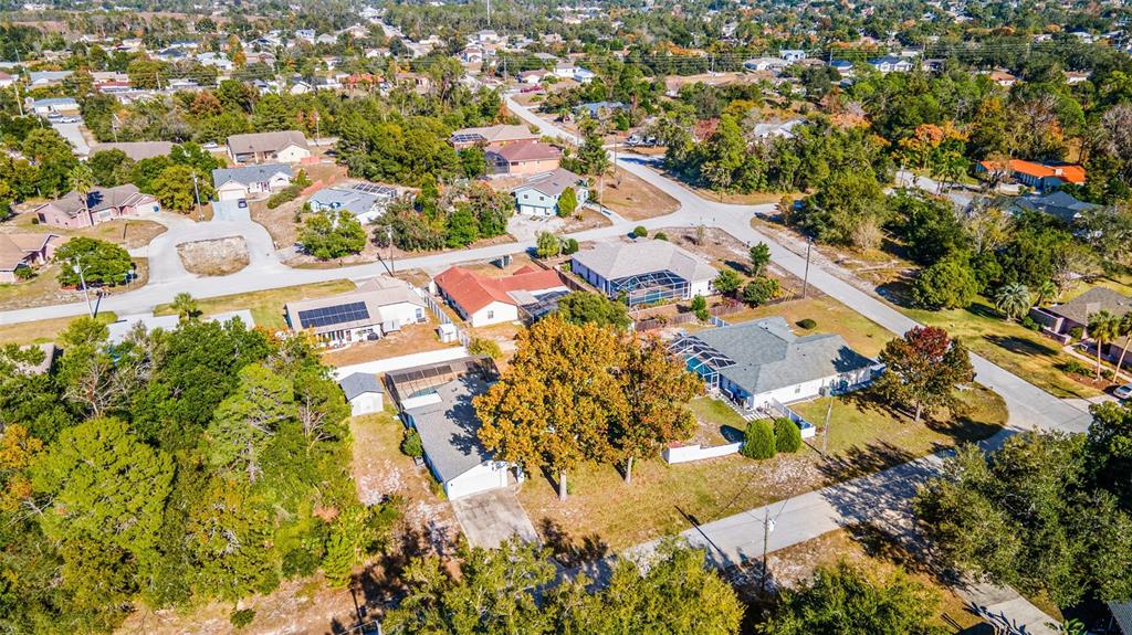 9061 Byron Street Spring Hill, FL 34606 - Photo 36 of 43 an aerial view of residential houses with outdoor space