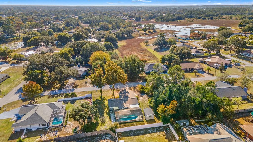 9061 Byron Street Spring Hill, FL 34606 - Photo 41 of 43 an aerial view of residential houses with outdoor space