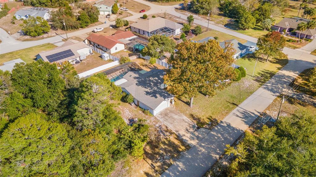 9061 Byron Street Spring Hill, FL 34606 - Photo 42 of 43 an aerial view of residential houses with outdoor space