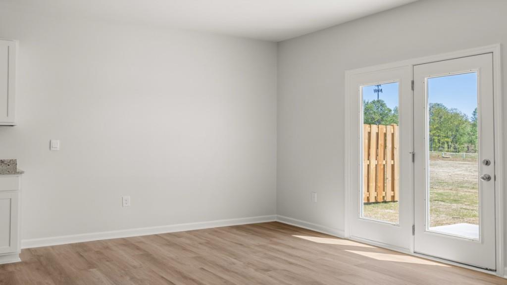 33 Rolling Mdw Trace Jasper, GA 30143 - Photo 11 of 38 a view of an empty room with wooden floor and a window