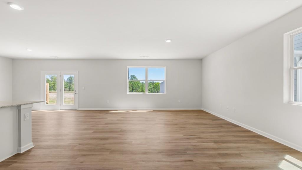 33 Rolling Mdw Trace Jasper, GA 30143 - Photo 13 of 38 an empty room with wooden floor and windows
