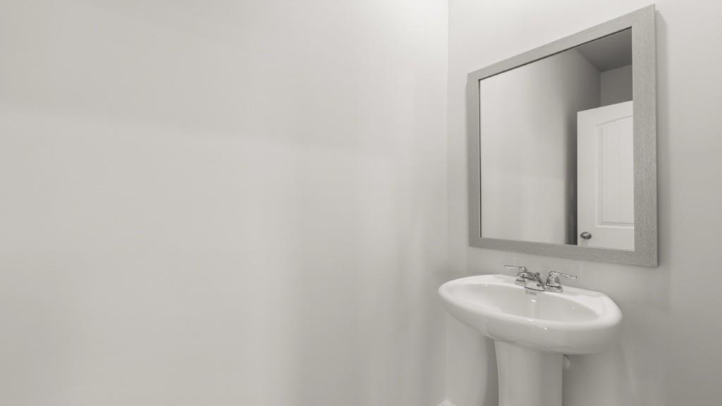 33 Rolling Mdw Trace Jasper, GA 30143 - Photo 16 of 38 a bathroom with a sink and a mirror
