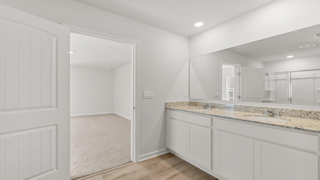 33 Rolling Mdw Trace Jasper, GA 30143 - Photo 22 of 38 a bathroom with a granite countertop sink and a mirror