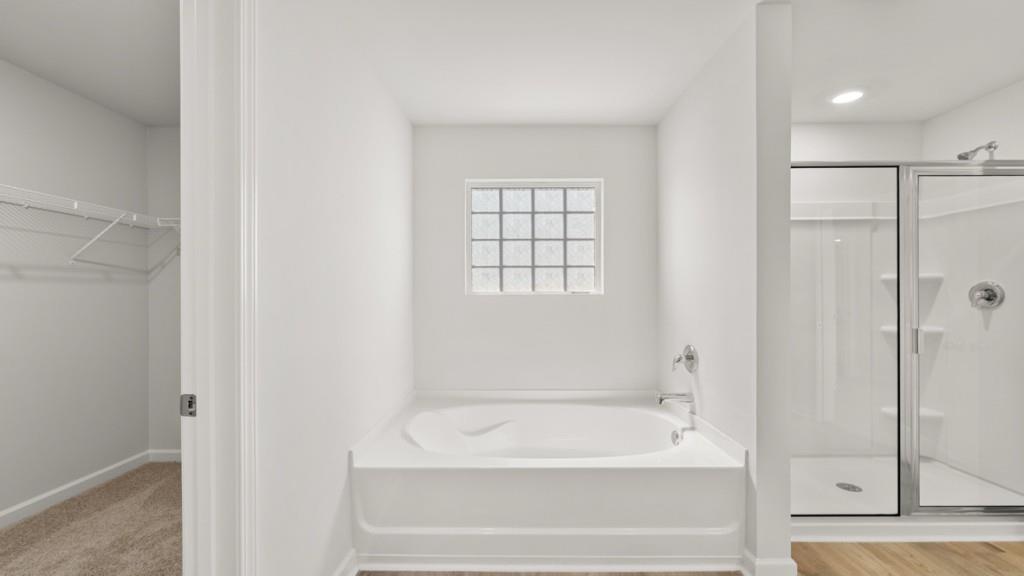 33 Rolling Mdw Trace Jasper, GA 30143 - Photo 23 of 38 a bathroom with a bathtub and a shower