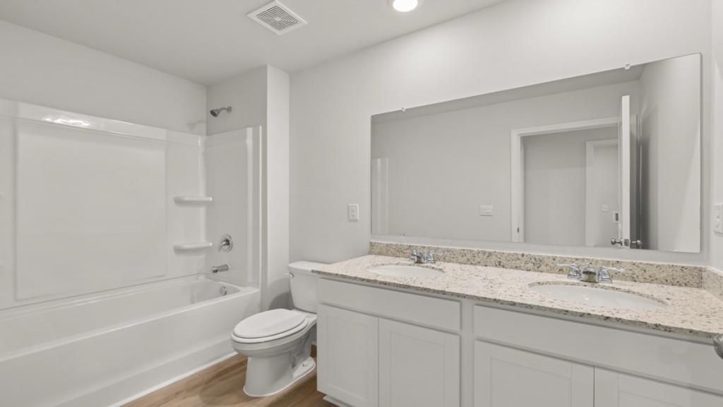 33 Rolling Mdw Trace Jasper, GA 30143 - Photo 35 of 38 a bathroom with a granite countertop sink toilet and shower